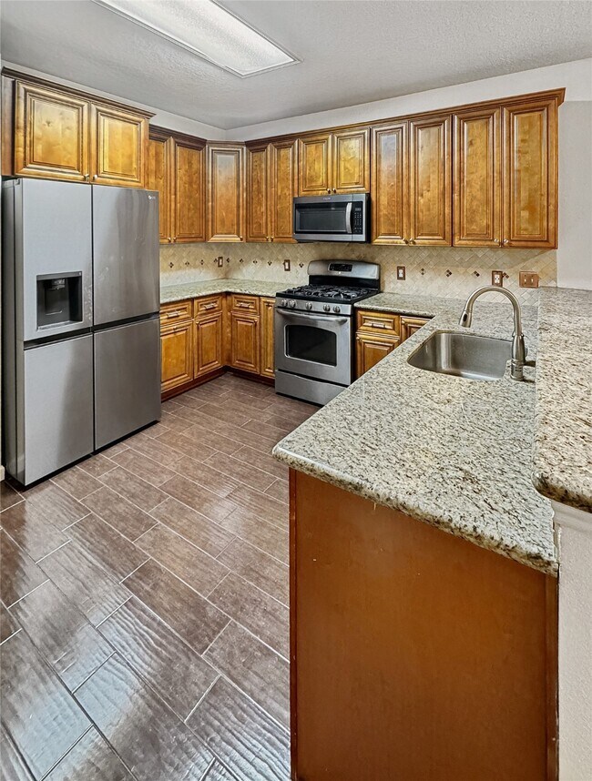 Building Photo - 18707 Woodbreeze Dr
