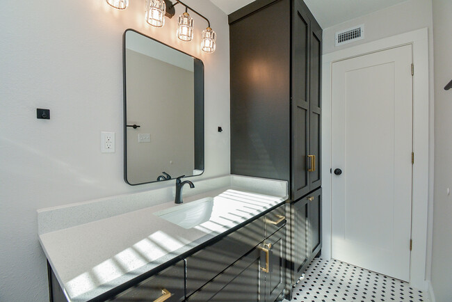 Bathroom has natural lighting and hand-built cabinets - 2916 Arbor St