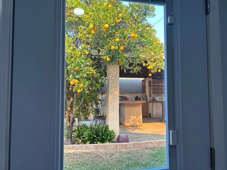 Exit door next to outside shared kitchen - 6008 Damask Ave