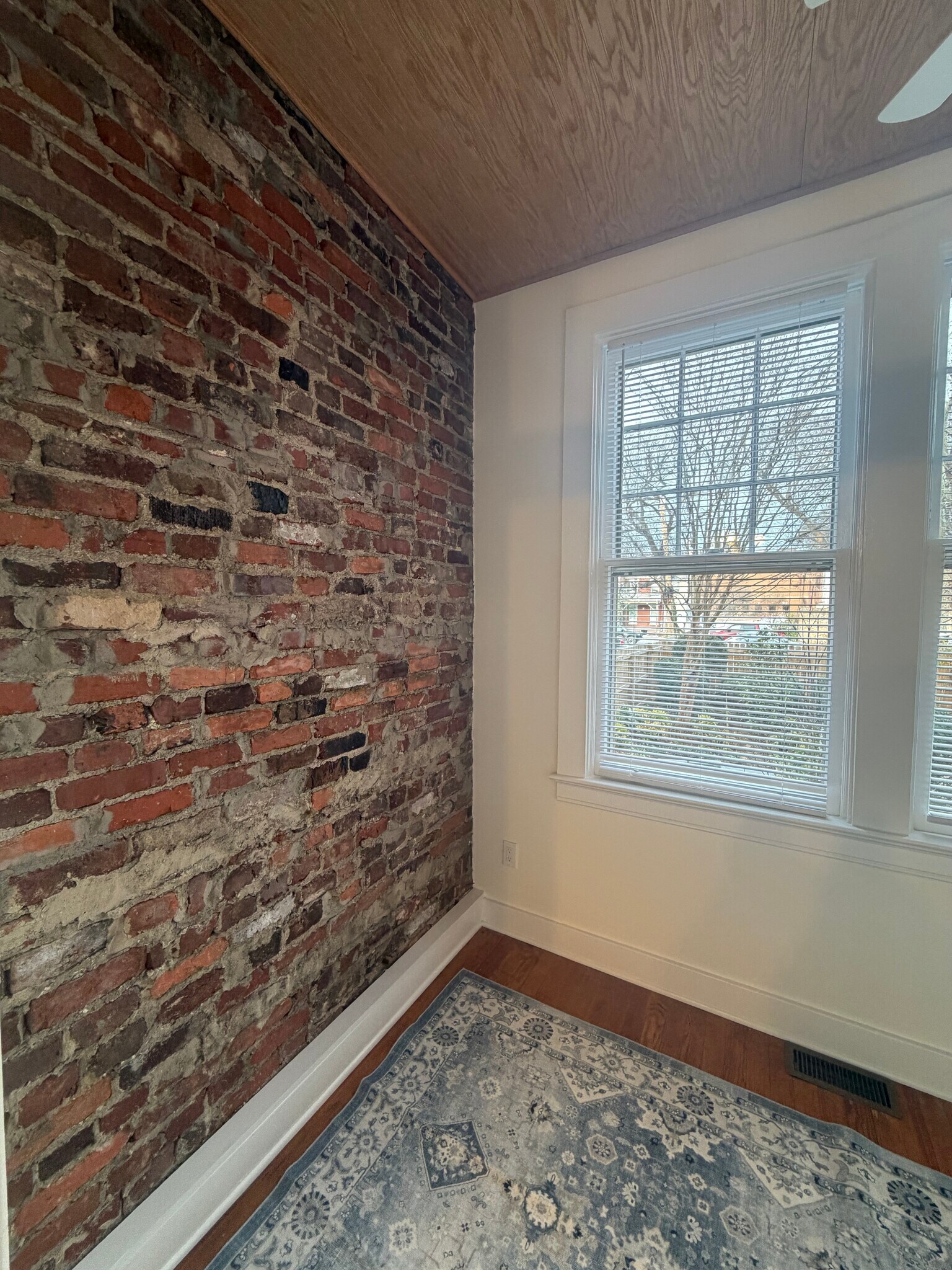 Exposed brick in bonus room - 2808 Floyd Ave