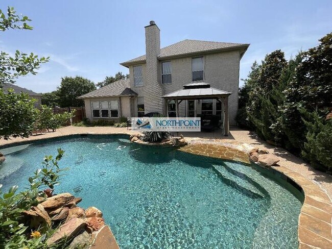 Building Photo - Stunning corner lot home with beautiful pool and upgrades throughout.