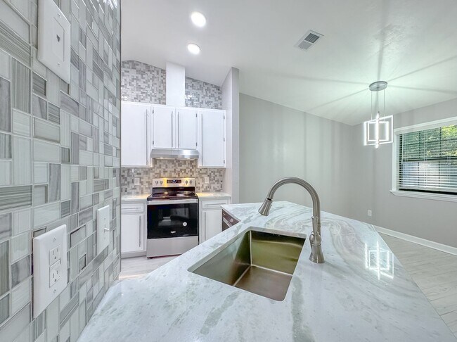 Building Photo - MODERN & Redone 1/1 w/ Tile Floors Throughout, Stainless Appliances, Granite Counters, Washer/Dry...