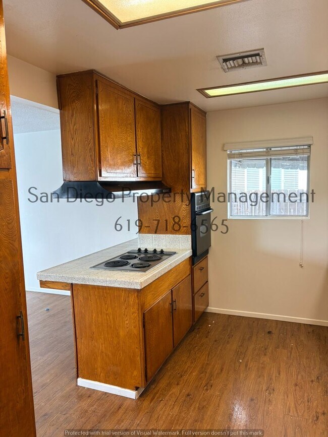 Building Photo - Charming 3-Bed with New LVP Flooring & Scenic Backyard Views