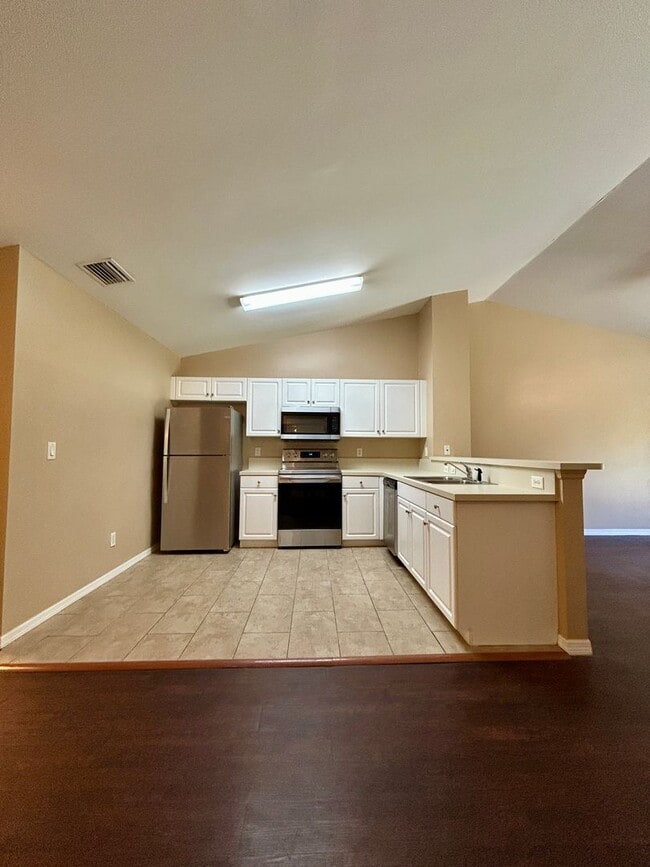 Building Photo - Charming 3BR/2BA Lehigh Acres Duplex with 1-Car Garage | Lawn Care & Salt Service Included