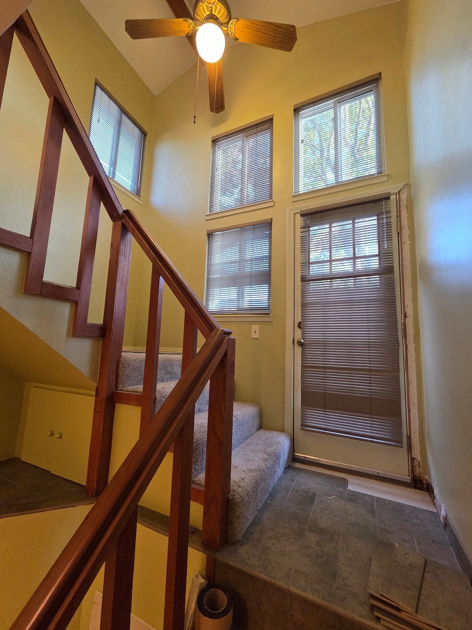 Stairway to backyard deck and loft. Lots of natural light. - 2753 Sulphur Dr