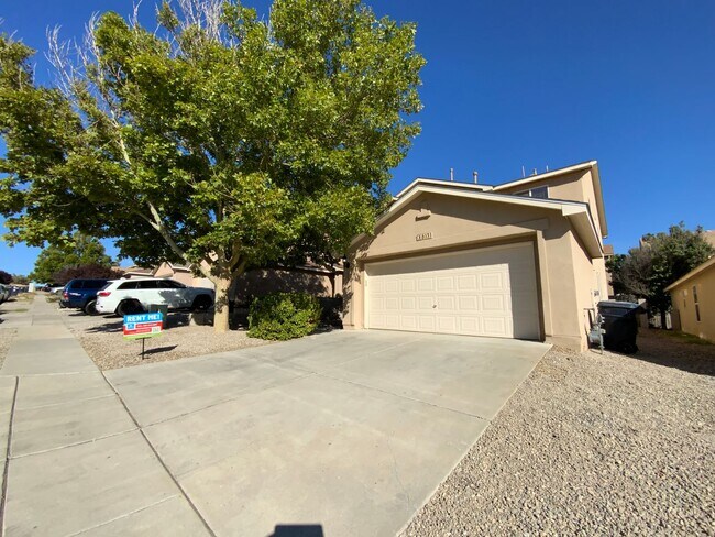 Building Photo - 3 Bedroom Home Available Near Unser Blvd N...