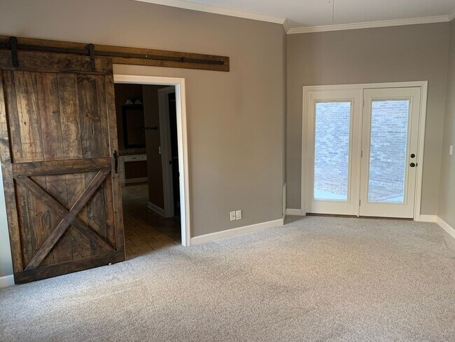 Building Photo - Luxury Living! Beautiful Brick Home in Sango with 3 car garage.