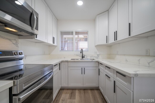 Building Photo - Rarely available ground floor townhome unit! 2 bdrm/2 bath/1 parking at Waiau Gardens Villa in Pe...