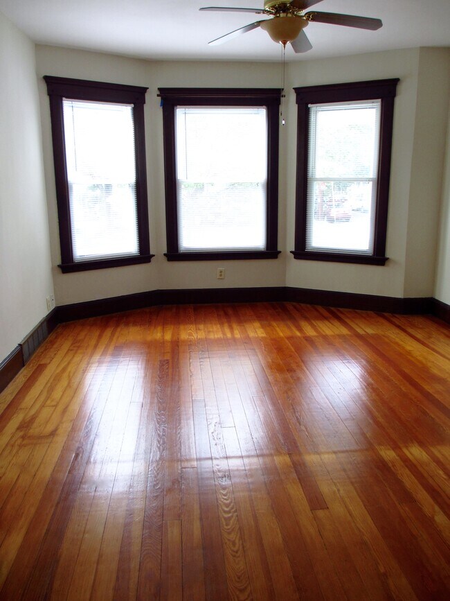 Living room - bright & airy; ceiling fan - 127 Foster St