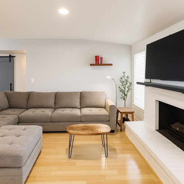 Relax by the fireplace—perfect for evening downtime. - 10116 Mercedes St