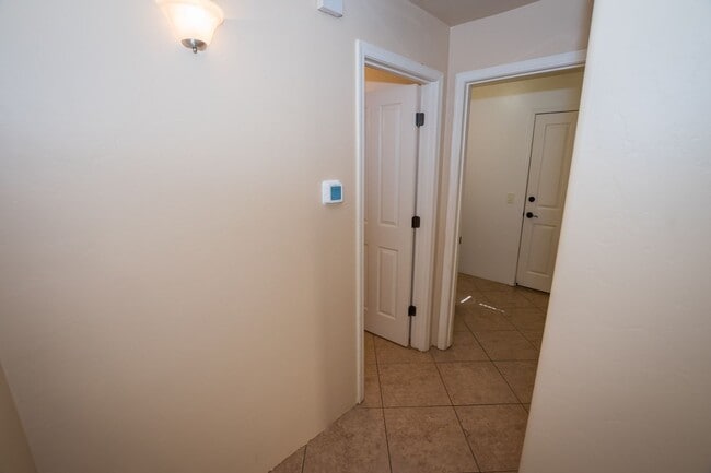 Building Photo - Gorgeous 3 Bedroom 2 Bathroom Home with Tile Throughout! Central A/C, 2 Car Garage!