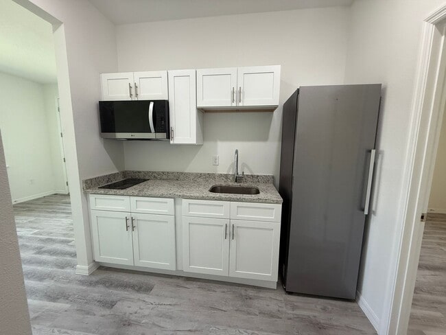 Building Photo - New Construction Suite! 1/1 Side entry uni...