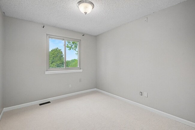 Building Photo - Updated 4BR Corner Lot Home with Finished Basement & 2-Car Garage