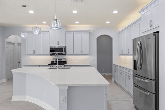 Building Photo - Spacious 6-Bedroom Home Near Lake Nona | 3-Car Garage + Tesla Charger