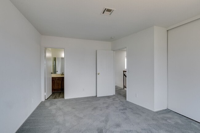 Building Photo - Double Primary Townhome with Spacious Backyard in 89115!