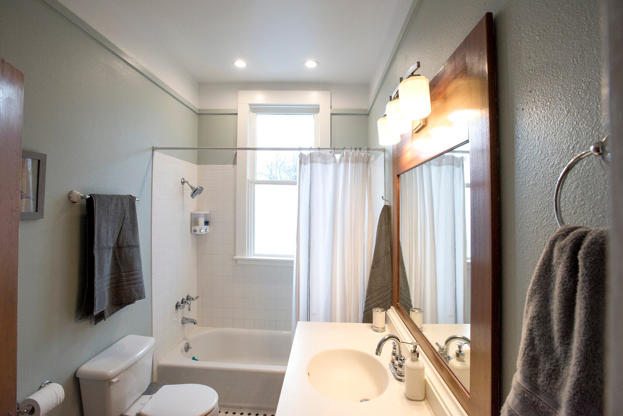 Full bath with lots of beautiful natural natural light and large tub/shower - 403 Gillespie St