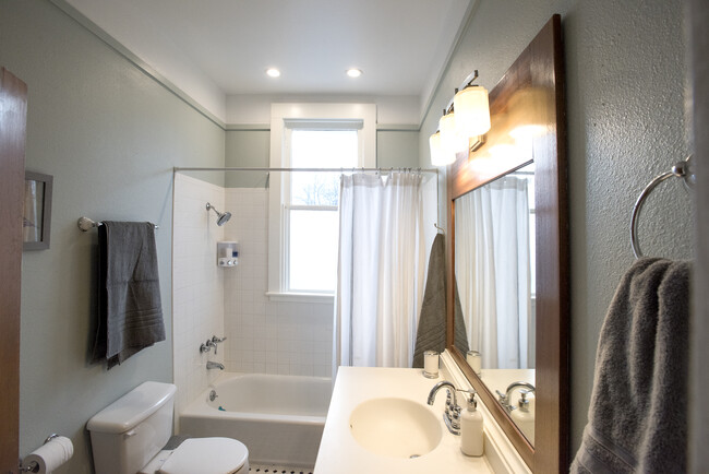 Full bath with lots of beautiful natural natural light and large tub/shower - 403 Gillespie St