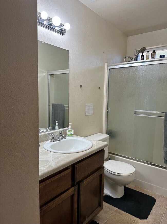 Building Photo - Charming Redding Home with Fireplace & Vau...