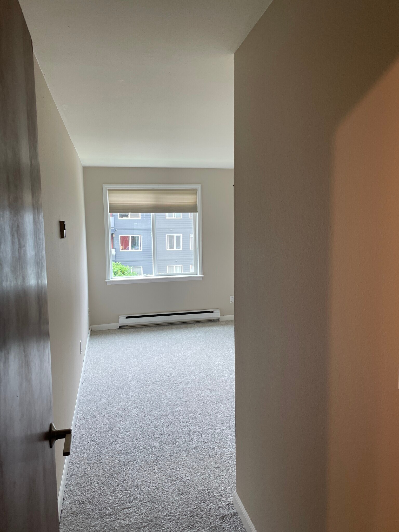 Entering large bedroom with brand-new carpet and roomy closet - 7001 Sand Point Way NE