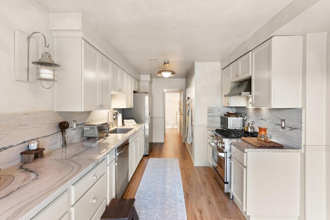 Kitchen looking into Washer/Dryer area and 1/2 Bath - 22855 S Van Deene Ave