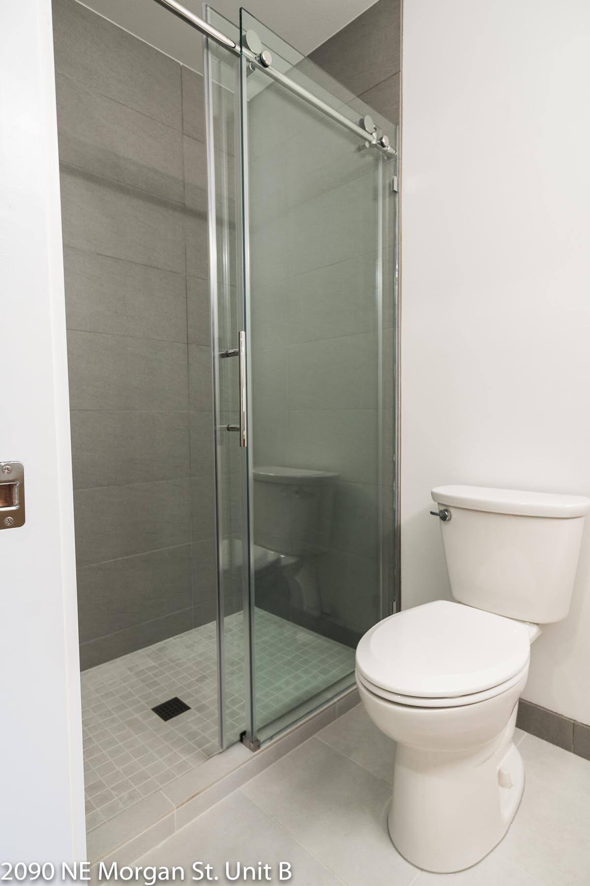 Remodeled bathroom with tile floors, walk in shower - 2090 NE Morgan St