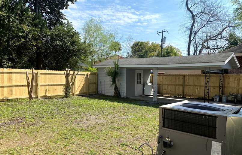 Carport in fenced backyard - 228 E 52nd St