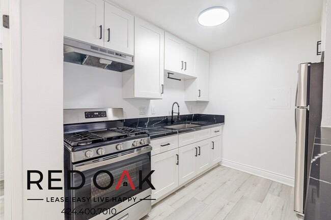 Building Photo - 6555 1/4 La Mirada Ave-10