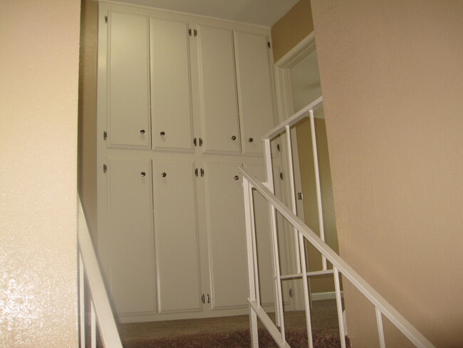 STAIRCASE / UPPER & LINEN CABINETS - 10071 San Juan Ct