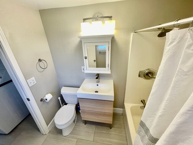 Building Photo - Prime Location! Modern 2BD/1 BA with A/C & EV Charging Steps from Mississippi