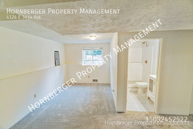 Building Photo - 4124 E 34th Ave