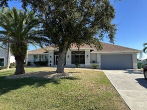 Building Photo - "Spacious 4-Bedroom 2 bathroom pool home"