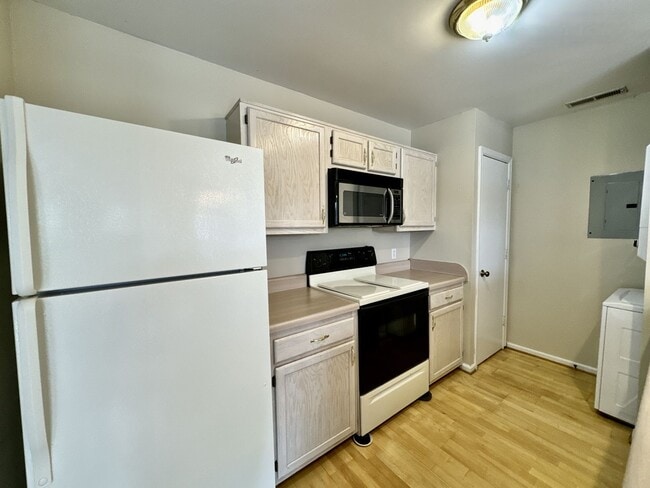Building Photo - Available 06-15-25! End-Unit Condo w/2 Pri...