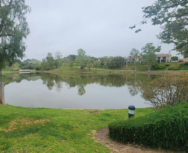 Building Photo - Gorgeous 2 bedroom newly renovated upstairs corner condo in gated community with pool & hill side...