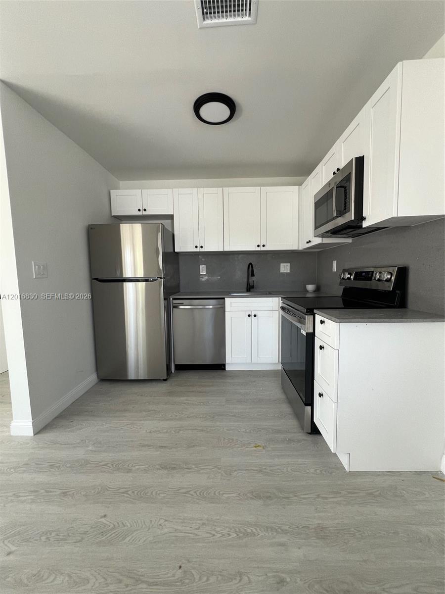 Building Photo - 1831 NE 56th St