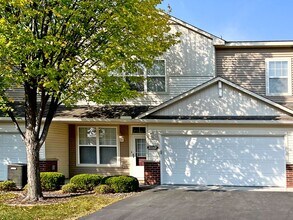 Building Photo - Upscale Townhome with Large Office-Loft, 3 Baths, 2-Car Attached Garage, Quartz Countertops and M...