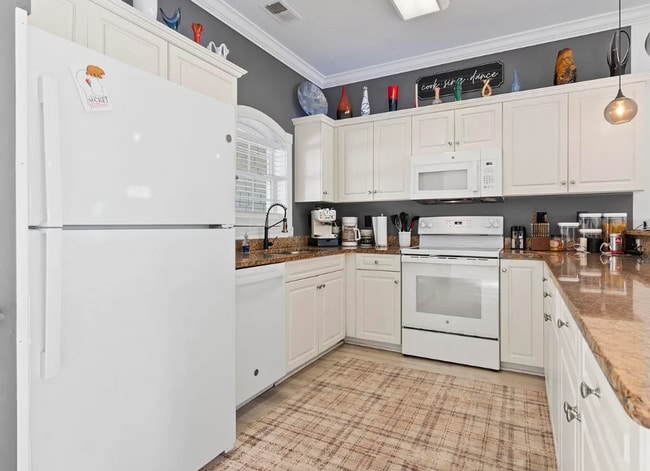 Building Photo - Stunning Top-Floor 2-Bedroom Retreat with Serene Pond Views!