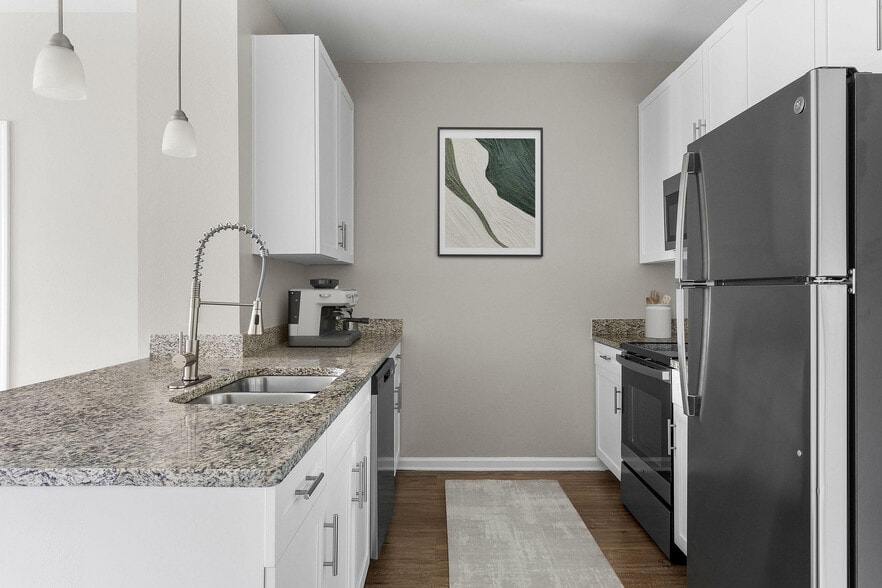 Experience culinary delight in this elegantly designed modern kitchen. - The Addison at South Tryon