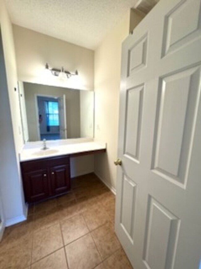 Building Photo - Relax and Unwind in this Spacious End-Unit...