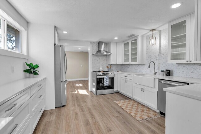 Building Photo - A spacious 3-bedroom, 2-bath layout provides plenty of room for family and guests!