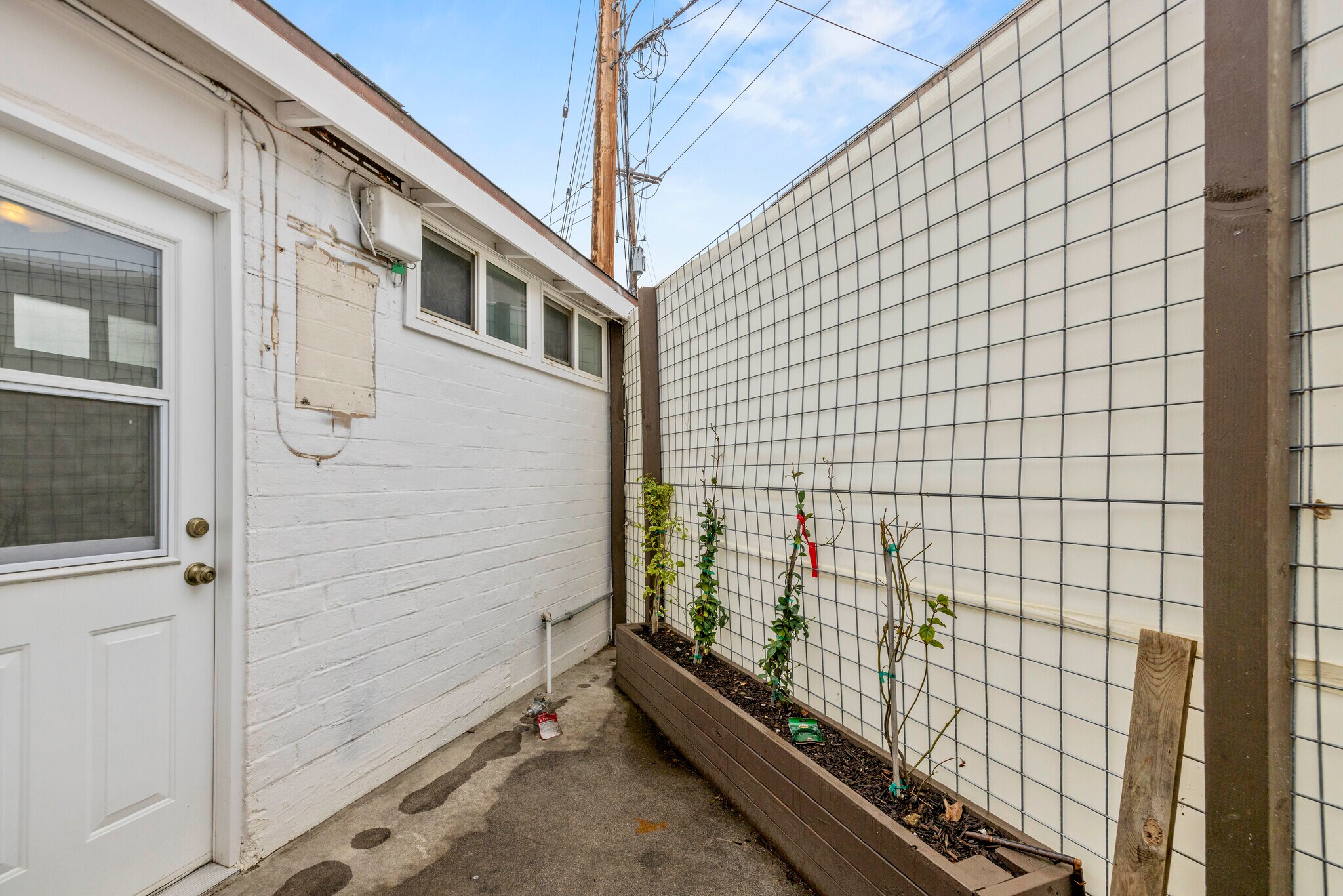 private patio off kitchen and bedroom - 1223 S Chavez St