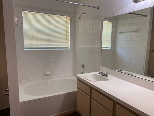 Building Photo - Stylish 2 Bed, 2 Bath Condo with New Vinyl...