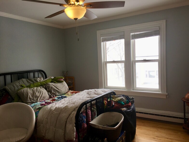 The front bedroom with ceiling fan and east facing windows. - 1320 Jefferson St NE