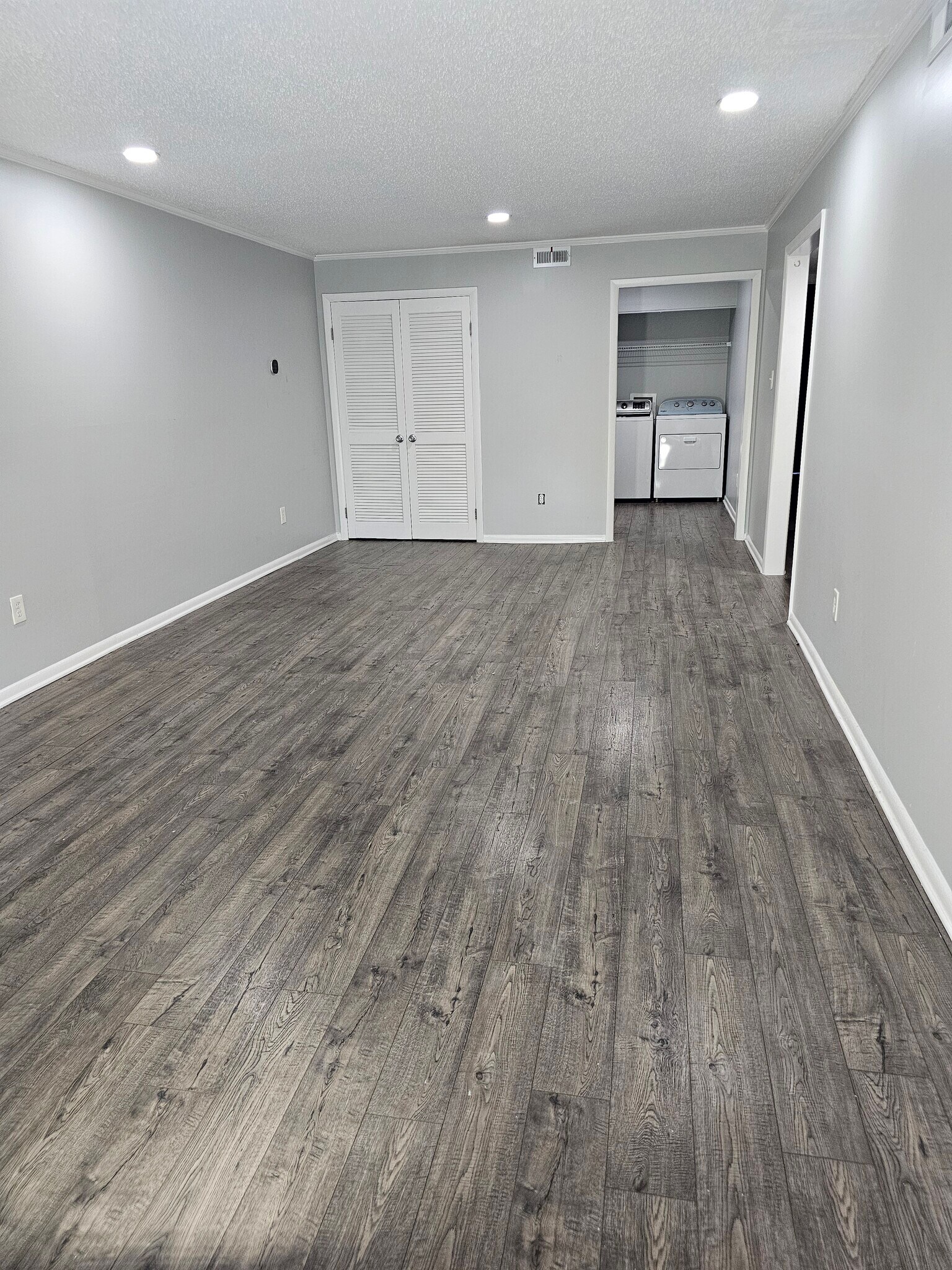 An exceptionally deep living room. plenty of space to design your perfect setup. - 8582 Chesapeake Blvd