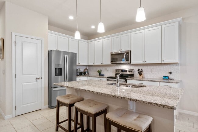 Building Photo - Water Front Home- 4 Large Bedrooms-3 baths Gated Community Call Sheila Campbell 407-687-7900