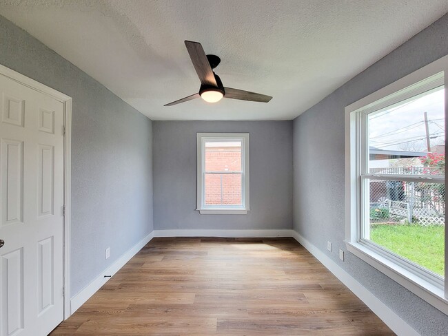 Building Photo - This beautifully updated 4-bedroom home is just under two miles from Highway 288 and Loop 610, ma...