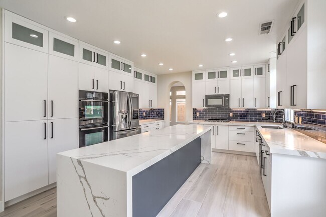 Building Photo - Luxury 5-Bedroom Home in Guard-Gated Community with 3-Car Garage