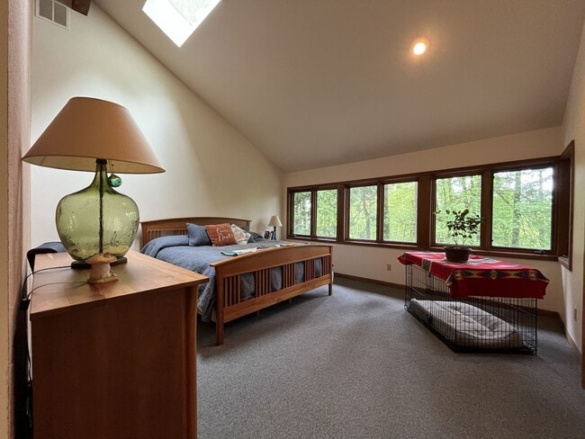 Building Photo - One-of-a-Kind Custom Home with Wall of Windows, Stone Fireplaces, Expansive Entertainment Space &...