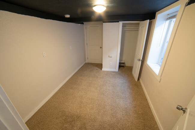 Basement 2. Door leads to utility room for storage / furnace / crawlspace - 5410 Monaco St