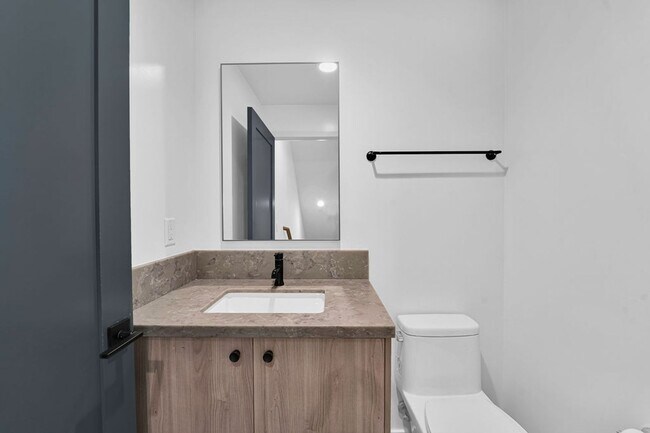 Building Photo - Modern 4-Bed with Rooftop Balcony & Dual Primary Suites