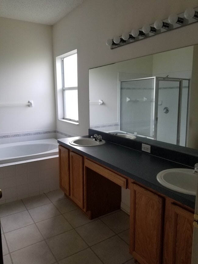 Building Photo - Lovely Four Bedroom with Pond View